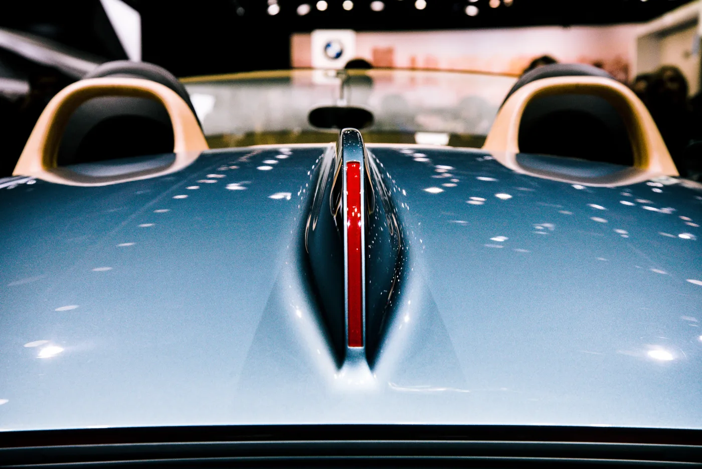 Close-up of the body and wheel of a classic car, showing details that deserve a closer look.